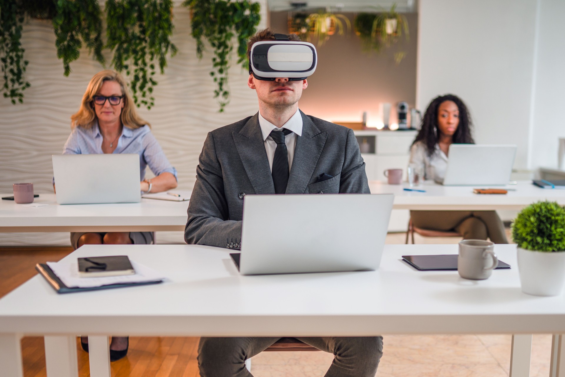Mid Adult Caucasian Businessman Using Virtual Reality Simulator and Working in Office